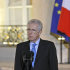 Italian Prime Minister Mario Monti delivers a speech to reporters after a meeting with French President Nicolas Sarkozy at the Elysee Palace, in Paris, Friday, Jan. 6, 2012. The leaders of France and Italy will meet in Paris to discuss a spiraling debt crisis that is threatening to engulf both of their economies. (AP Photo/Christophe Ena)