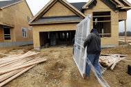 <p>               In this Feb. 8, 2012 photo, two workers carry a window for a home  under construction in a new subdivision by Toll Brothers, in Yardley, Pa. Sales of new U.S. homes dipped in January but only after the government said the final quarter of 2011 was stronger than first estimated. (AP Photo/Alex Brandon)