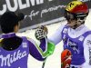 First-placed Hirscher of Austria celebrates with third-placed Yuasa of Japan after the men's World Cup slalom race in Madonna di Campiglio