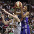 Phoenix Mercury's DeWanna Bonner, right, pulls down a rebound in front of Seattle Storm's Lauren Jackson during the first half of Game 1 of a first-round WNBA playoff basketball series Thursday, Sept. 15, 2011, in Seattle. (AP Photo/Elaine Thompson)