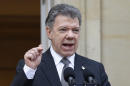 Colombia's President Juan Manuel Santos speaks to the media after a welcoming ceremony for South Korea's President Park Geun-hye at the presidential palace in Bogota, Colombia, Friday, April 17, 2015. In a sharply worded rebuke, Santos said Colombians' patience is wearing thin after guerrillas this week attacked an army platoon sleeping in the field and killed 11 soldiers. (AP Photo/Fernando Vergara)