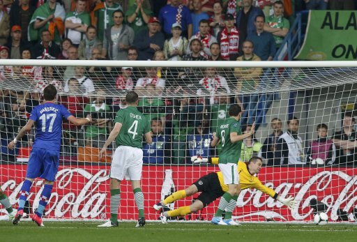 Croatia's Mandzukic scores past Ireland's Given as Ireland's O'Shea and Andrews look on during their Group C Euro 2012 soccer match at the City Stadium in Poznan