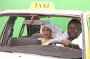 Actors on the set of new TV show "Taxi Tigui" during filming in Bamako
