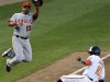 Angels' third Izturis fails to make the out as Orioles' Jones steals in the fourth inning during their MLB American League baseball game in Baltimore