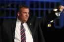Republican New Jersey Governor Chris Christie waves to supporters at his election night party in Asbury Park, New Jersey