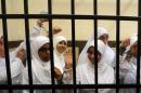 Female members of the Muslim Brotherhood during their trial in the Egyptian city of Alexandria on November 27, 2013
