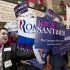 Volunteers supporting Republican presidential hopefuls Rick Santorum and Mitt Romney vie for attention as America's political right gathers for the Conservative Political Action Conference (CPAC) in Washington,  Saturday, Feb. 11, 2012.  (AP Photo/J. Scott Applewhite)