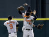 Baltimore Orioles' Nate McLouth (9), Nick Markakis (21) and Adam Jones celebrate after the Orioles defeated the Houston Astros in a baseball game Tuesday, June 4, 2013, in Houston. The Orioles won 4-1. (AP Photo/David J. Phillip)