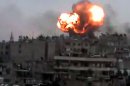 An image from YouTube is said to show flames rising shelling by Syrian government forces on the city of Homs