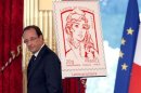 French President Hollande unveils the new official Marianne post stamp at the Elysee Palace in Paris