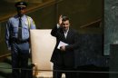 Iran's President Ahmadinejad waves after addressing the 67th United Nations General Assembly at U.N. headquarters in New York
