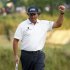 Phil Mickelson of the U.S. reacts after his birdie on the 17th green to take the lead during the third round of the 2013 U.S. Open golf championship at the Merion Golf Club in Ardmore