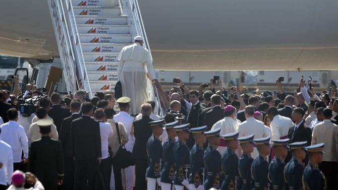 Pope Francis boards the plane during a departure ceremony at Villamor Airbase in Manila, on January 19, 2015