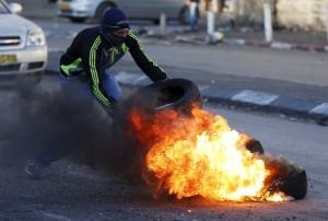 Palestinians clash with Israeli border police during &hellip;
