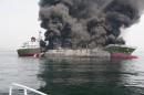 Black smoke rises from a 998-tonne oil tanker off the coast of Hyogo prefecture, around 450 km west of Tokyo, on May 29, 2014