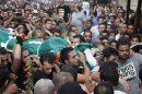 Palestinian mourners carry the body of a Palestinian man during his funeral in Sabra refugee camp in Beirut