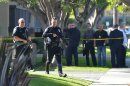 Torrance police and fire respond to a call at Golden West Tower on Maricopa Street in Torrance, Calif., Tuesday afternoon, Nov. 20, 2012. Three people died Tuesday in what appears to be a double murder-suicide at the senior citizens' high-rise south of Los Angeles, police said. (AP Photo/The Daily Breeze, Robert Casillas)