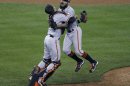 San Francisco Giants relief pitcher Romo jumps into the arms of catcher Posey after defeating the Detroit Tigers to win the MLB World Series baseball championship in Detroit