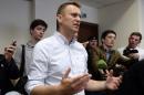 Russian opposition leader Alexei Navalny talks to the media during a hearing at Moscow's Lyublinsky district court on May 13, 2015