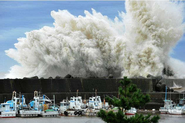 Surging waves hit against the breakwater in Udono in a port town of Kiho, Mie Prefecture, central Japan, Wednesday, Sept. 21, 2011. A powerful typhoon was bearing down on Japan's tsunami-ravaged north