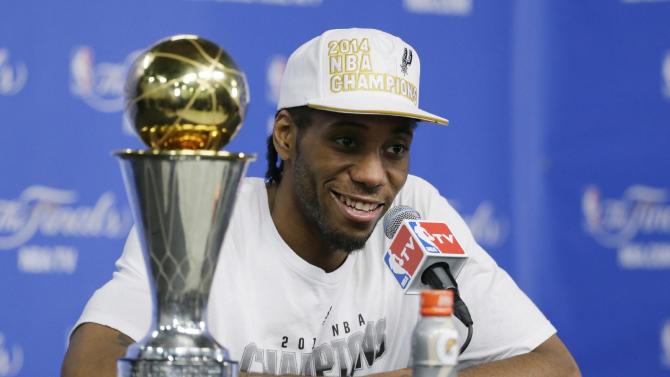 Most Valuable Player San Antonio Spurs forward Kawhi Leonard listens to a question at a news conference after  Game 5 of the NBA basketball finals against the Miami Heat on Sunday, June 15, 2014, in San Antonio