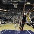 Indiana Pacers' Paul George (24) goes up for a dunk against Atlanta Hawks' Al Horford during the second half of Game 1 in the first round of the NBA basketball playoffs, Sunday, April 21, 2013, in Indianapolis. Indiana won 107-90. (AP Photo/Darron Cummings)