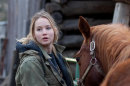 In this film publicity image released by Lionsgate, Jennifer Lawrence is shown in a scene from 