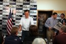 Republican presidential candidate, former Massachusetts Gov. Mitt Romney (L) and US Rep Paul Ryan (R) greet volunteers