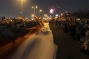 A general view shows fireworks as supporters of former prime minister and current presidential candidate Ahmed Shafik shout slogan against the Muslim Brotherhood's presidential candidate Mohamed Morsy in Cairo