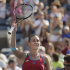 Flavia Pennetta of Italy gestures to the crowd after winning her match against Maria Sharapova of Russia during the U.S. Open tennis tournament in New York, Friday, Sept. 2, 2011. (AP Photo/Charlie Riedel)