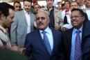 Former Yemeni president Ali Abdullah Saleh (L) and Yemen's Minister of Communications Ahmed Bin Daghr (R) on the first anniversary of the handover of power in Sanaa on February 27, 2013