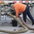 In this Feb. 28, 2012 photo, a delivery driver connects hoses on a gasoline tanker, prior to replenishing the tanks at a BP station in Pittsburgh. The nationwide average for regular unleaded slipped less than a penny to $3.764 per gallon on Tuesday, March 6,2012. That ended a streak of price hikes that began on Feb. 8.  (AP Photo/Gene J. Puskar)