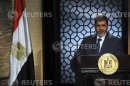 Muslim Brotherhood's president-elect Mohamed Mursi speaks during his first televised address to the nation in Cairo
