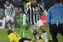 Juventus' Carlos Tevez celebrates after scoring during the Champions League round of 16 first leg soccer match between Juventus and Borussia Dortmund at the Juventus stadium in Turin, Italy, Tuesday, Feb. 24, 2015. (AP Photo/Antonio Calanni)