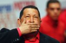 File photo of Venezuela's President Hugo Chavez blowing a kiss as he arrives at a rally with supporters in Caracas