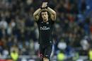 FILE - In this Tuesday, Nov. 3, 2015 file photo, PSG's David Luiz waves to his team's supporters after the Champions League group A soccer match between Real Madrid and PSG at the Santiago Bernabeu stadium in Madrid. David Luiz is set to return to Chelsea under new coach Antonio Conte after two years at Paris Saint-Germain, it was announced Wednesday, Aug. 31, 2016. Chelsea says it has struck a deal with PSG on transfer deadline day to re-sign the Brazil defender, who now has to complete a medical examination and agree personal terms. (AP Photo/Francisco Seco, file)