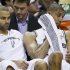 Spurs' Duncan and Parker sit on the bench against the Heat in Game 4 of their NBA Finals basketball series in San Antonio