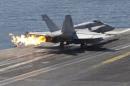 A F/A-18C Hornet of Marine Fighter Attack Squadron 251 (VMFA-251) is catapulted off the flight deck of the USS Theodore Roosevelt (CVN-71) aircraft carrier in the Gulf