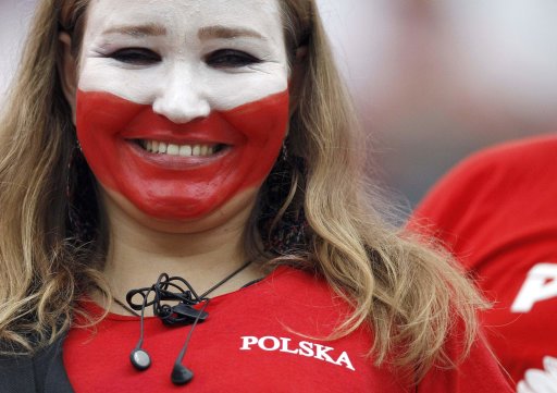 Poland fan smiles before the start of their Group A Euro 2012 soccer match against Greece at the National stadium in Warsaw