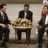 Former Japanese Prime Minister Yukio Hatoyama, left, speaks with Iranian President Mahmoud Ahmadinejad, during their meeting at the Iranian presidency office in Tehran, Iran, Sunday, April 8, 2012. An unidentified interpreter sits at center. (AP Photo/Vahid Salemi)