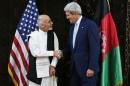 U.S. Secretary of State Kerry shakes hands with Afghanistan's presidential candidate Ghani at the start of a meeting at the U.S. embassy in Kabul