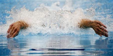 Michael Phelps of the U.S. swims in his men's 200m individual medley heat during the London 2012 Olympic Games