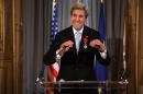 US Secretary of State John Kerry smiles after being awarded the Grand Officier de la Legion d'Honneur (Grand Officer of the Legion of Honor) medal, at the Quai d'Orsay in Paris, on December 10, 2016