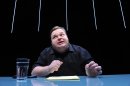 In this undated image released by The Public Theater, Mike Daisey is shown in a scene from 