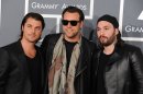 FILE - In a Feb. 10, 2013 file photo, Swedish House Mafia, from left, Axwell, Steve, Sebastian Ingrosso, and Steve Angello arrive at the 55th annual Grammy Awards, in Los Angeles. This year's Ultra Music Festival, which begins Friday, March 15, 2013, will feature the final performance of the Swedish House Mafia. (Photo by Jordan Strauss/Invision/AP, File)