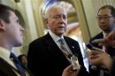 Senator Hatch talks to reporters during a series of votes in Washington