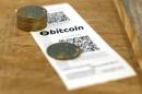 A Bitcoin (virtual currency) paper wallet with QR codes and coins are seen in an illustration picture taken at La Maison du Bitcoin in Paris
