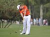 Rory McIlroy, of Northern Ireland, hits an approach shot to the third green during the third round of the Honda Classic golf tournament in Palm Beach Gardens, Fla., Saturday, March 3, 2012.  (AP Photo/Rainier Ehrhardt)