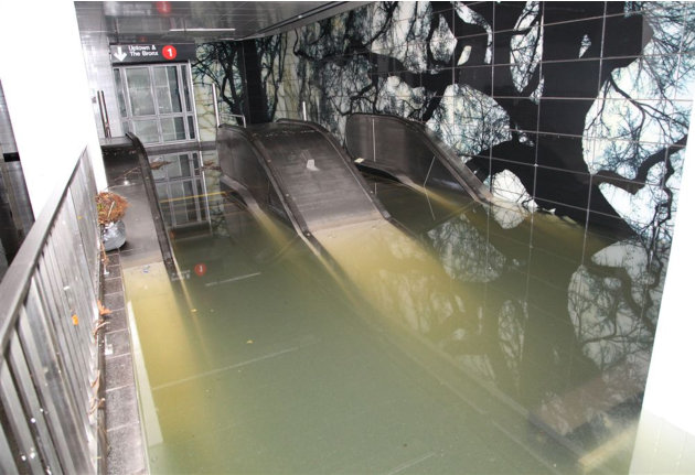 This Oct. 30, 2012, photo provided by New York's Metropolitan Transportation Authority (MTA) shows a flooded escalator in the South Ferry station of the No. 1 subway line, in lower Manhattan, after Su