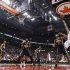 Raptors' Bargnani puts up a shot over Pacers' West during the first half of their NBA basketball game in Toronto